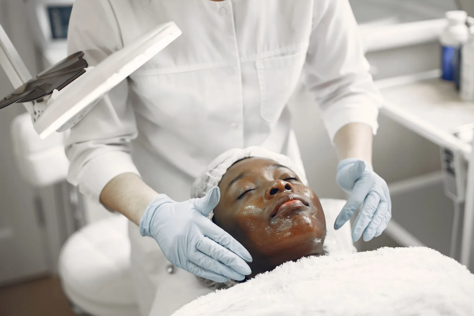 Esthetician performing a facial treatment